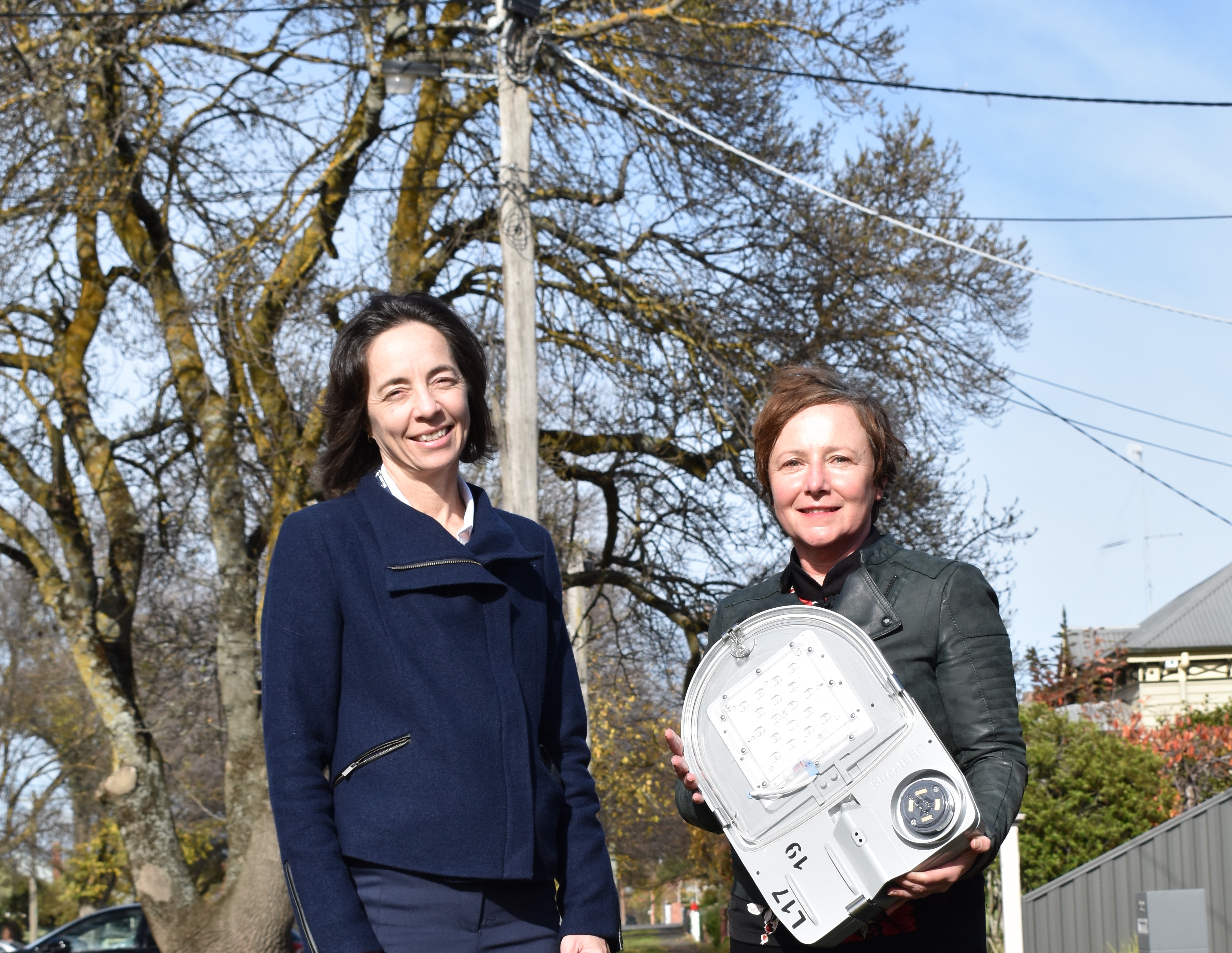 City of Ballarat Director Infrastructure and Environment Bridget Wetherall and Councillor Belinda Coates with an LED streetlight   