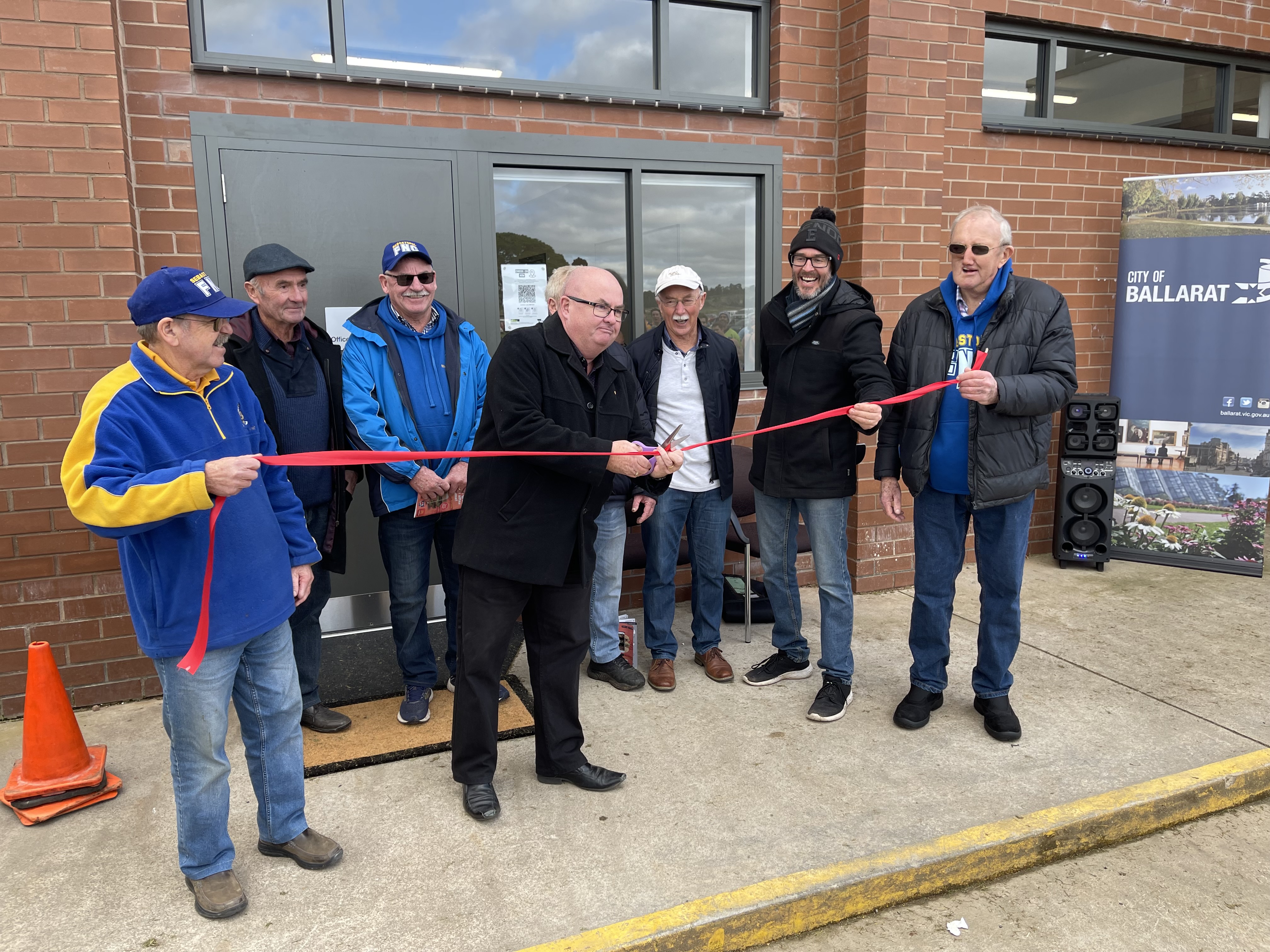 Cr Des Hudson cutting the ribbon at Marty Busch Reserve