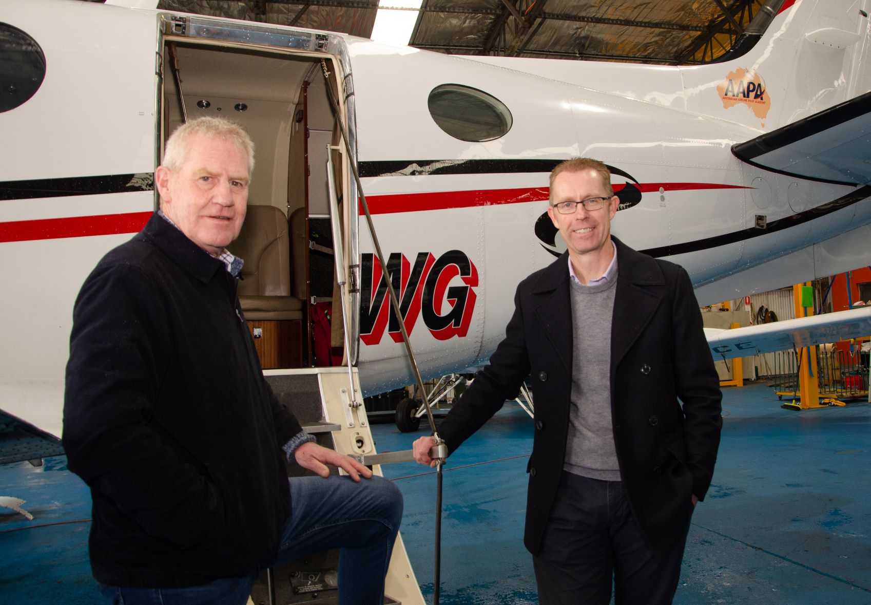 City of Ballarat Airport manager John Hartigan and City of Ballarat CEO Evan King at a hangar at Ballarat Airport  