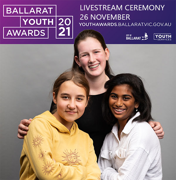 Photo of young people with purple youth awards banner in background