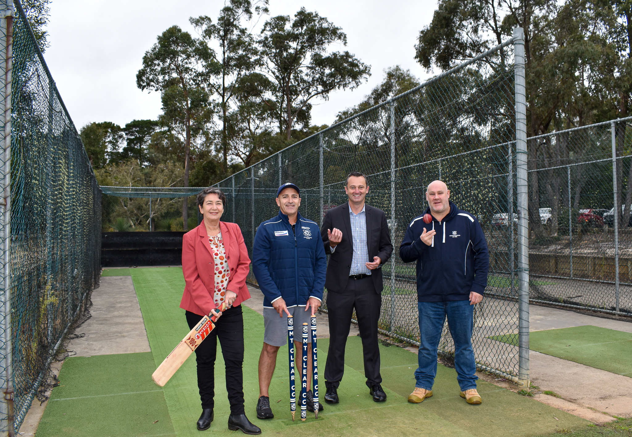 Member for Buninyong, Michaela Settle, Mt Clear Cricket Club representative, City of Ballarat Mayor, Cr Daniel Moloney and Mt Clear Cricket Club president Anthony Tigchelaar standing at the old cricket nets to be replaced