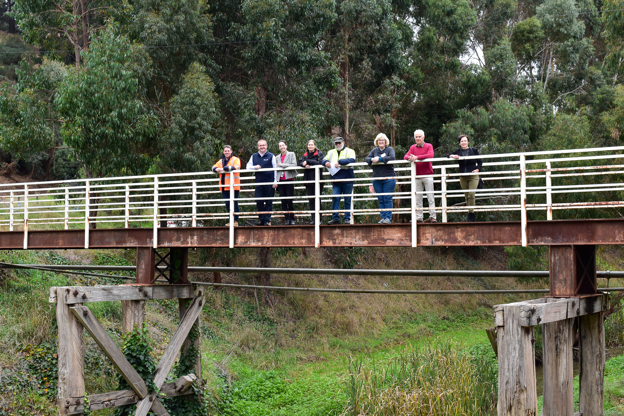 Cr Belinda Coates on Yarrowee footbridge with different environmental group representatives