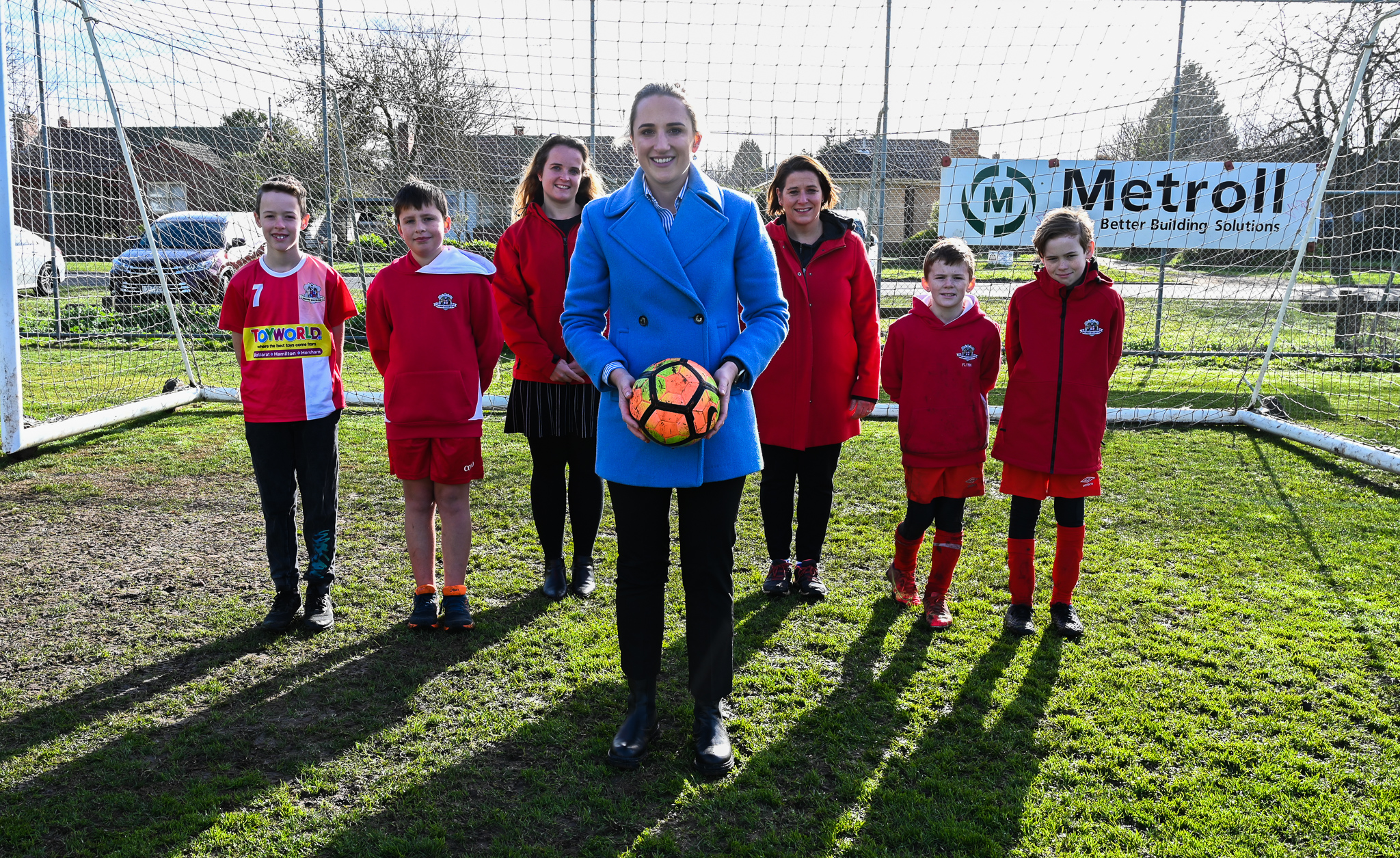 Cr Amy Johnson with Lucy Brennan and Julianna Addison and members of the Ballarat Soccer Club