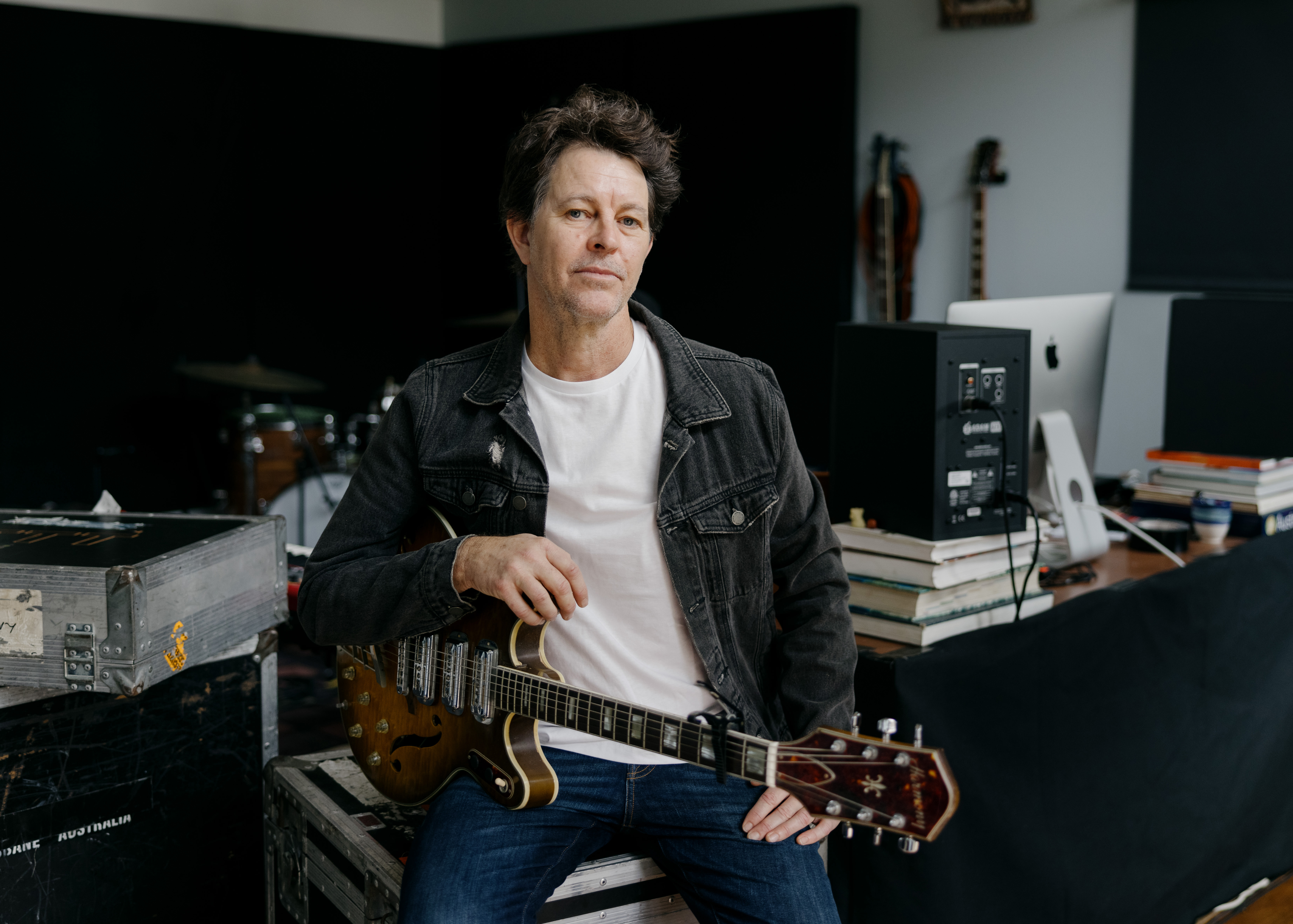 Bernard Fanning holding a guitar