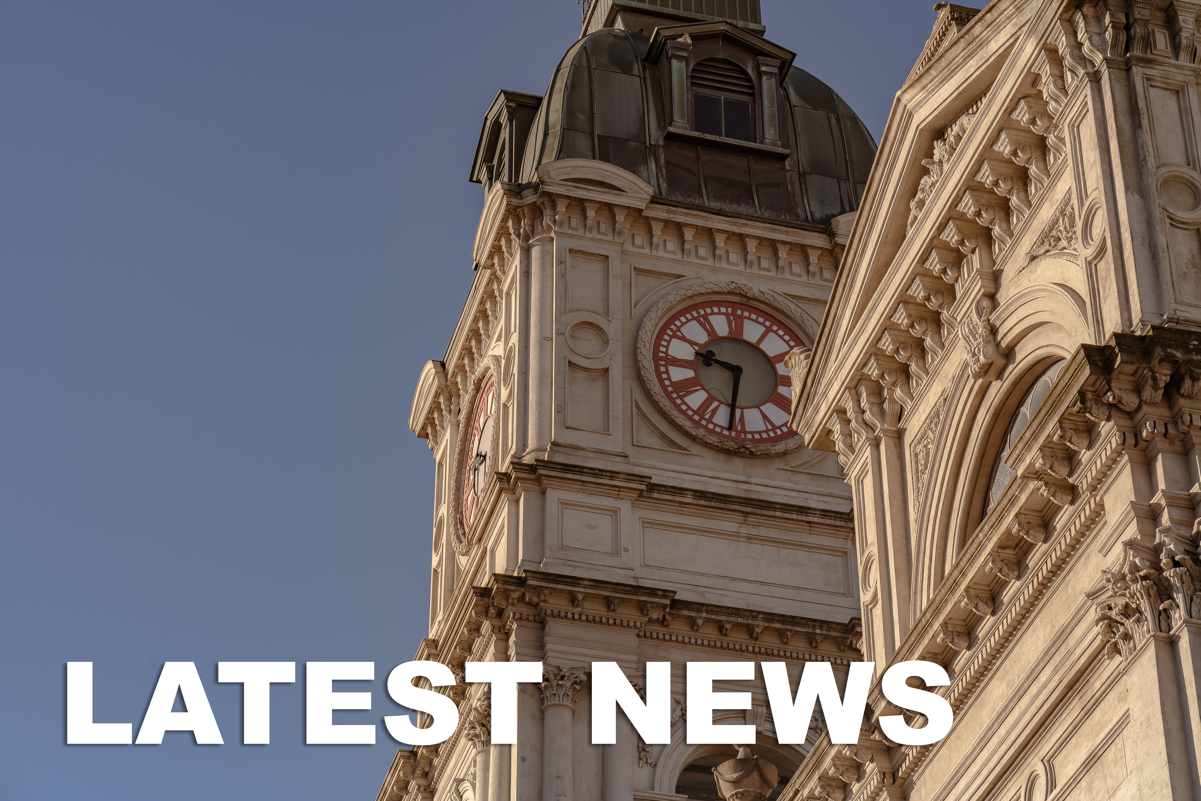Image of Town Hall clock with text inset that reads latest news