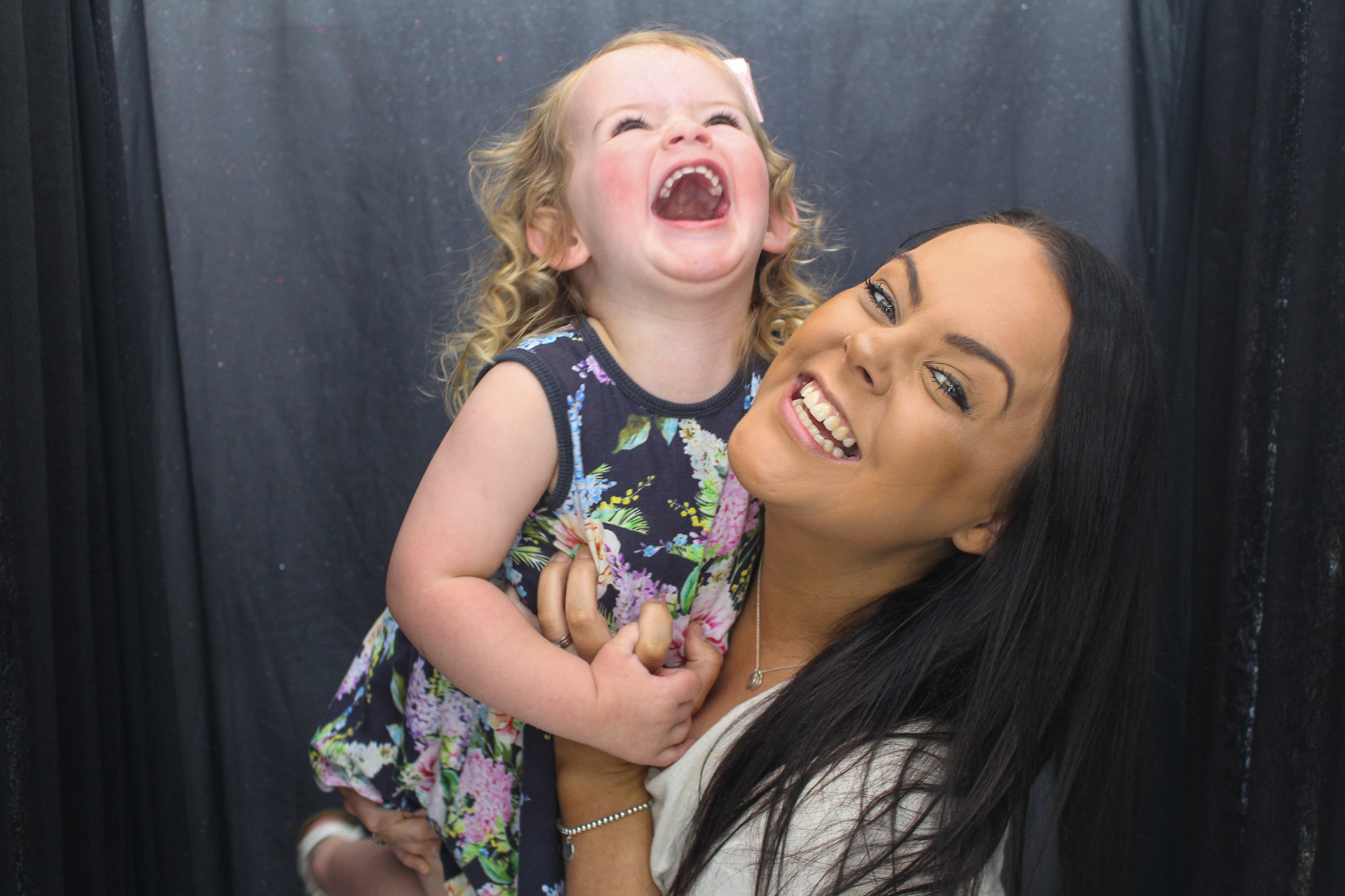 Woman holding Child laughing