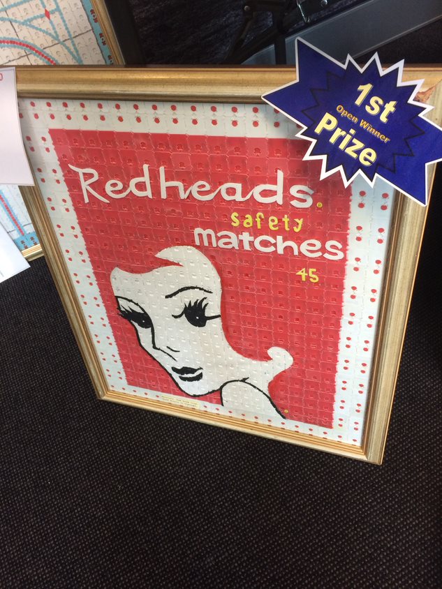 The winner of the 2018 open category - a framed image of the Redheads matches logo made from bread tags.