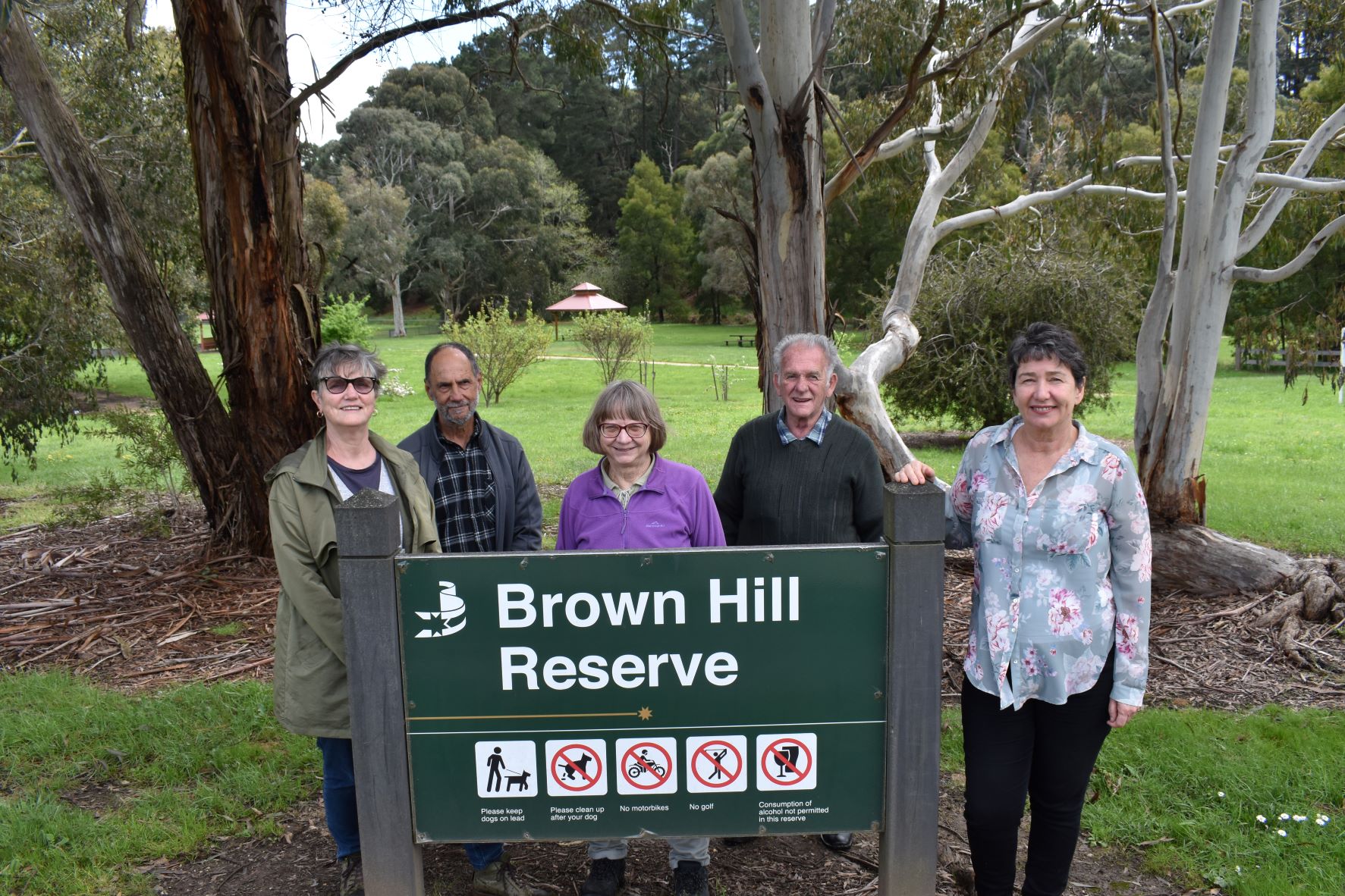Brown Hill residents with Michaela Settle MP behind a Brown Hill Reserve sign at Brown Hill Reserve  