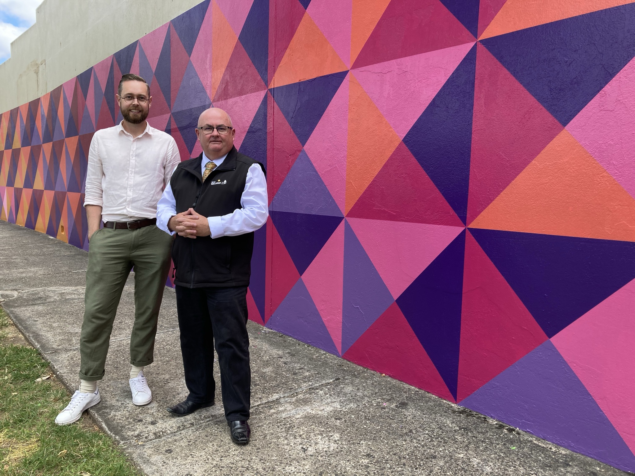 Generic image of Spencer Harrison and Mr Mayor in front of a colourful wall