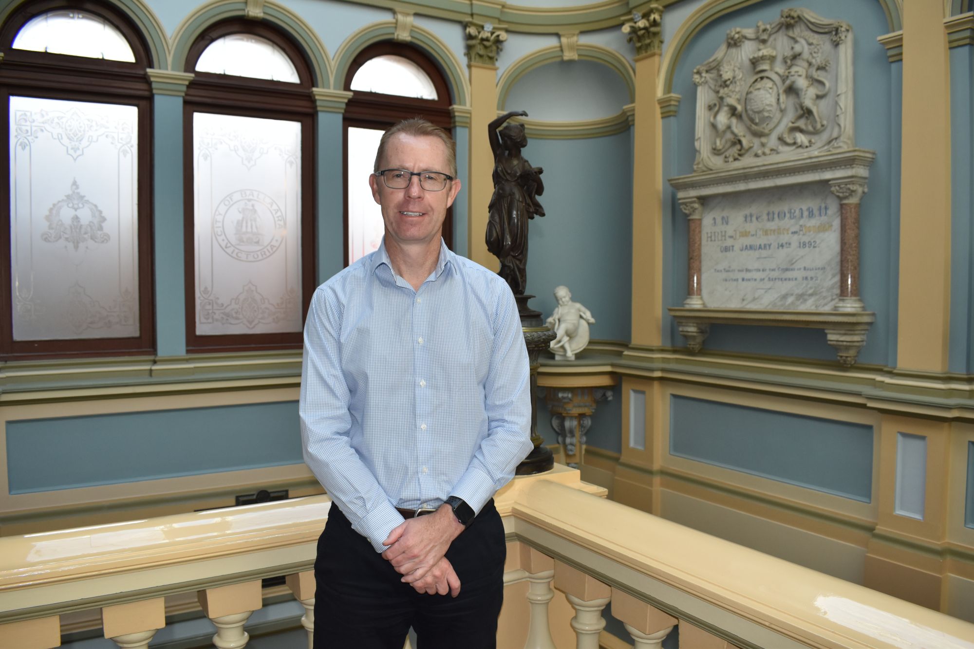 Image of CEO Evan King upstairs in the Town Hall on Sturt Street smiling to camera