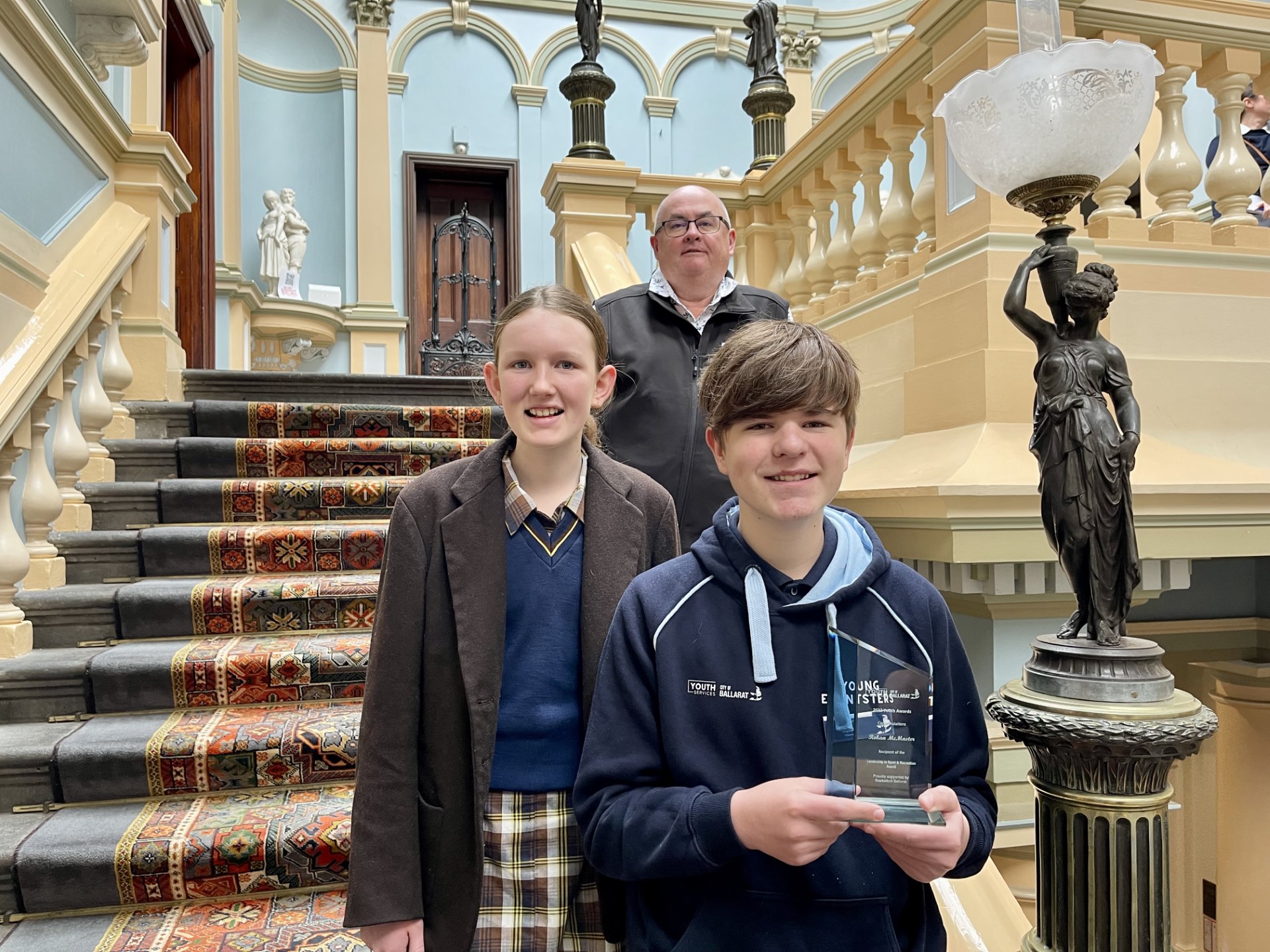 City of Ballarat Mayor, Cr Des Hudson with youth volunteers Shayla Cobbledick and Rohan McMaster