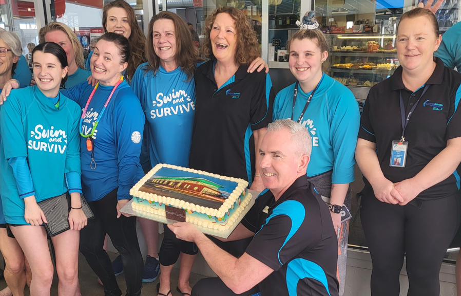 BALC staff with a celebratory cake to celebrate winning Victorian Swim Centre of the Year for its ‘Learn to Swim’ program