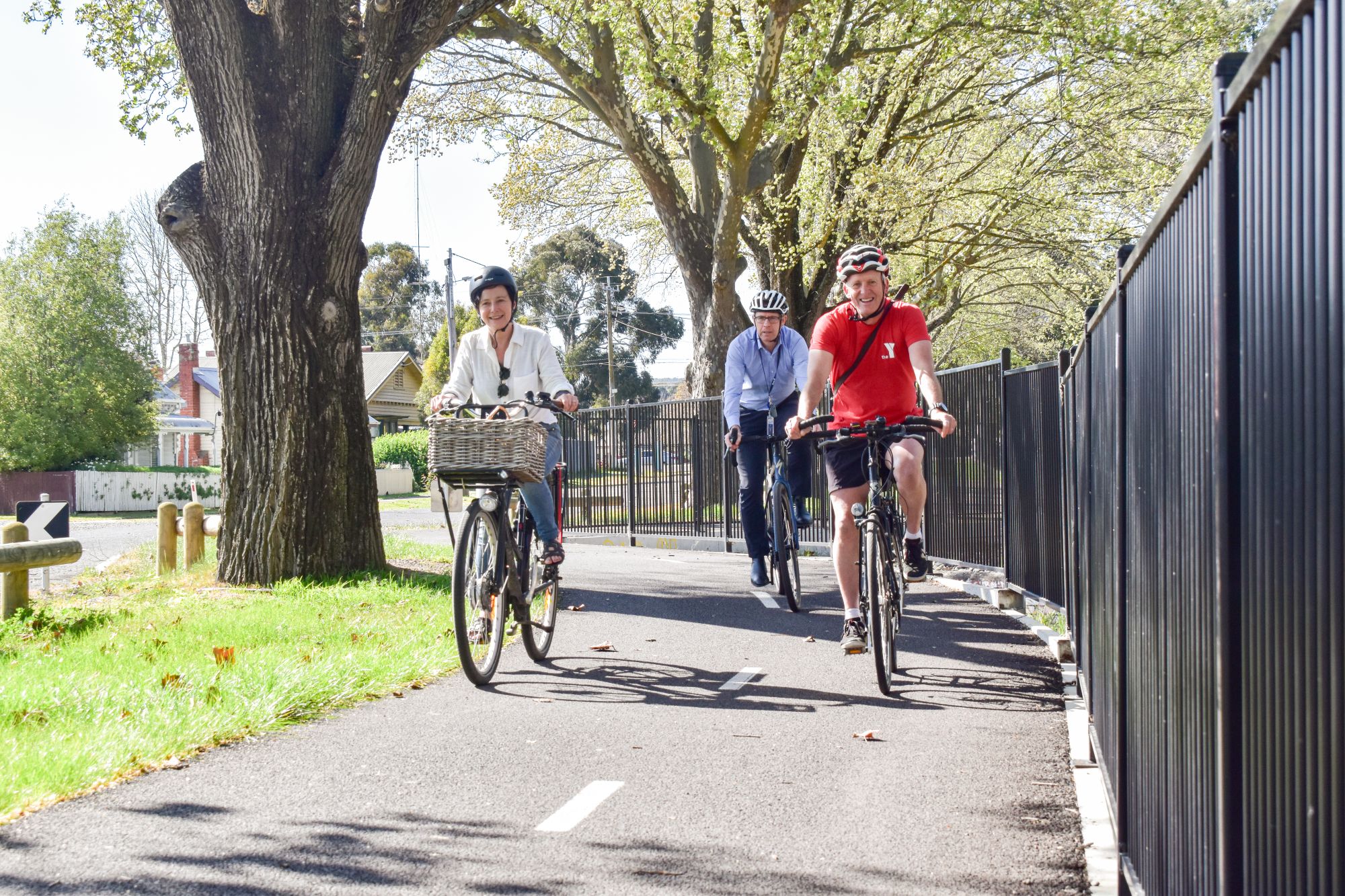 Generic image of Cr Coates, Evan King and Wallace Martin riding bikes on shared path
