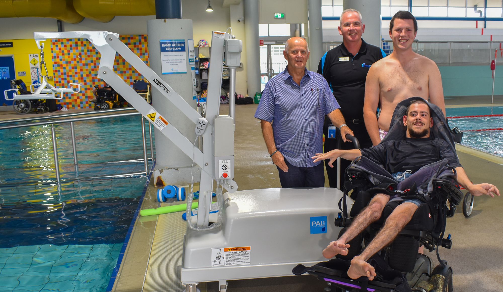 City of Ballarat Deputy Mayor, Cr Peter Eddy, Ballarat Aquatic and Lifestyle Centre manager Gerald Dixon, Pinarc Disability Support physiotherapist Isaac Hanneysee and the first user of the new hoist Lucas.