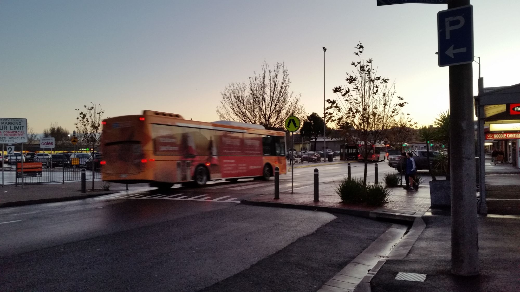 Little Bridge Street at sunset with a bus in background