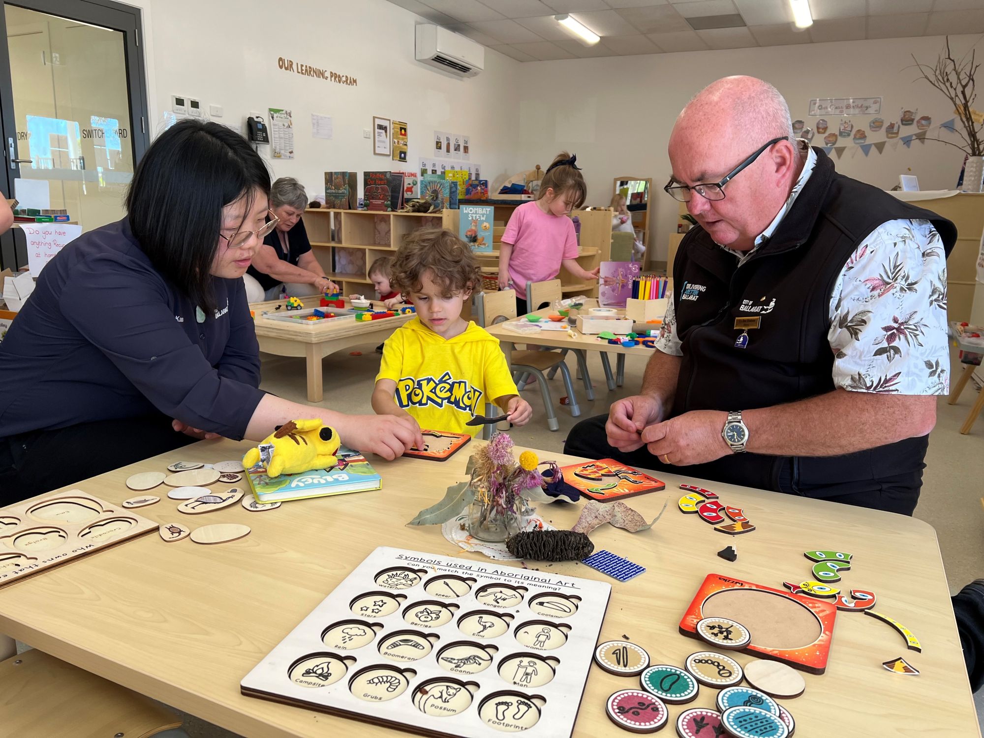 City of Ballarat Mayor, Cr Des Hudson (right) works on a puzzle with Heidi and City of Ballarat Early Childhood Teacher, Karen Li at Rowan View Children’s Centre.