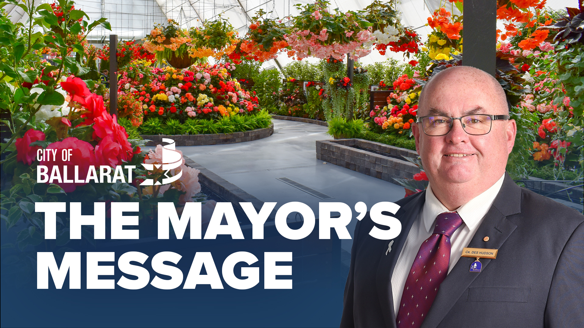 Text with The Mayor's Message with an image of Mayor Cr Des Hudson in front of the begonia display at the Botanical Gardens