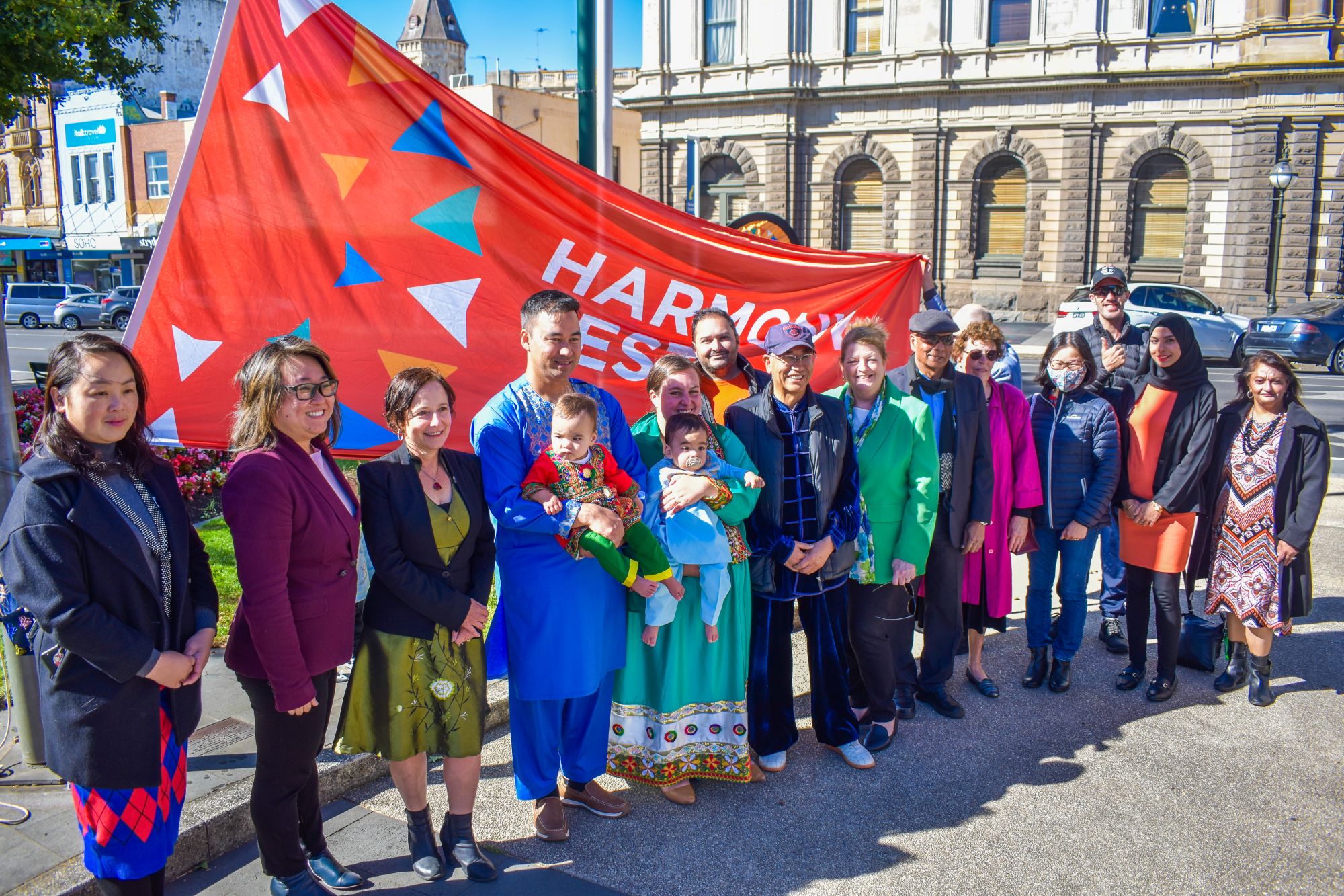 The Harmony Day flag raising in Queen Victoria Square.