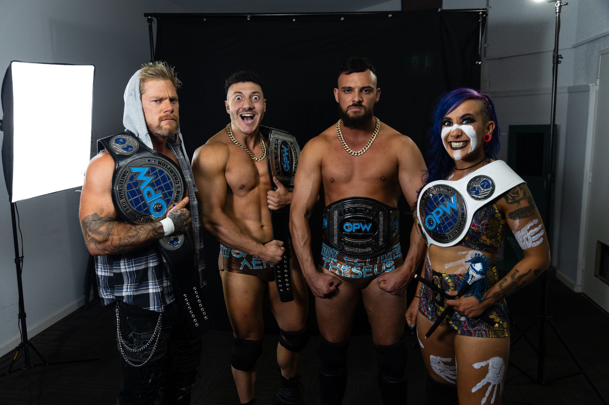 Four wrestlers posing