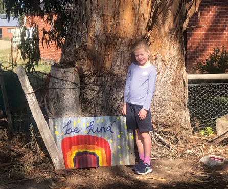 A canvas for kindness: Tahlee Featherston with her Be Kind rainbow artwork.