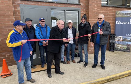 Cr Des Hudson cutting the ribbon at Marty Busch Reserve