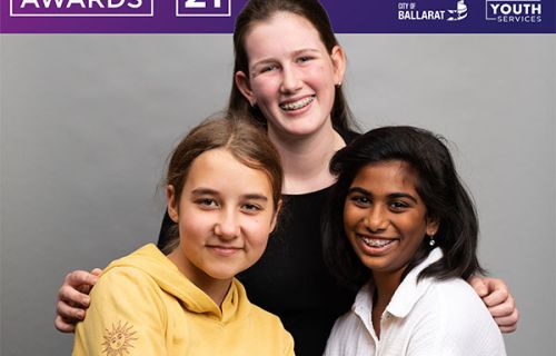 Photo of young people with purple youth awards banner in background