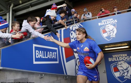 Western Bulldogs' Bailey Smith running out onto Mars Stadium in front of Ballarat sign