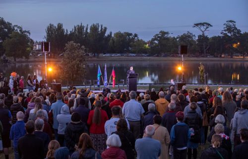 Crowd gathers at Lake Wendouree at dawn for Survival Day Ceremony