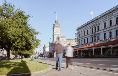 Couple walking down Sturt Street towards Town Hall in Ballarat