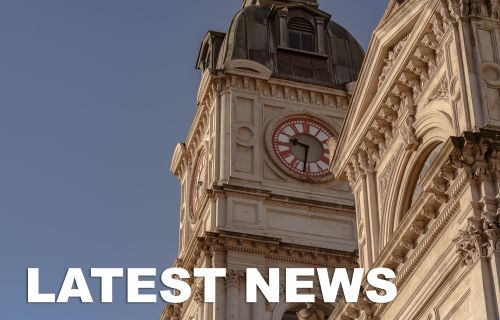 Image of Town Hall clock with text inset that reads latest news
