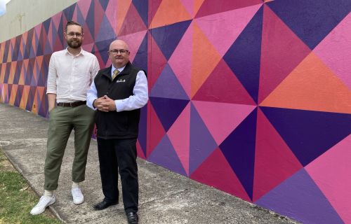 Generic image of Spencer Harrison and Mr Mayor in front of a colourful wall