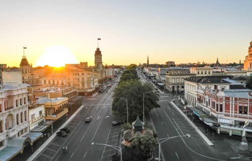 An aerial shot of Ballarat's central business district. In the centre there is a road with a trees in the middle and buildings on either side. 