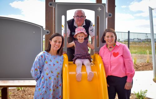 Minister for Children Lizzie Blandthorn, City of Ballarat Mayor Cr Des Hudson and Member for Wendouree Juliana Addison with Harlow at the opening of the new community hub and kindergarten in Alfredton.