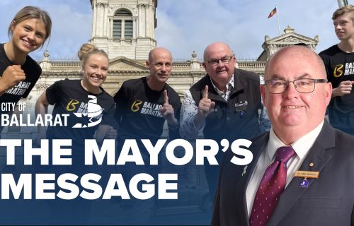 Text with The Mayor's Message with an image of Mayor Cr Des Hudson in front of an image of Ballarat marathon runner at Town Hall