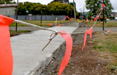 New footpath with orange bunting around it.