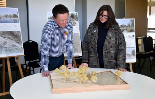 Generic image of people viewing a model