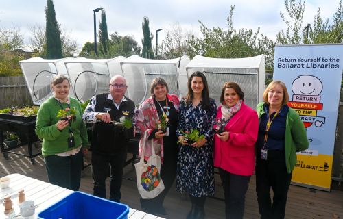 Generic image of people in front of community garden