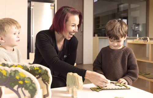 kinder image with educator and children