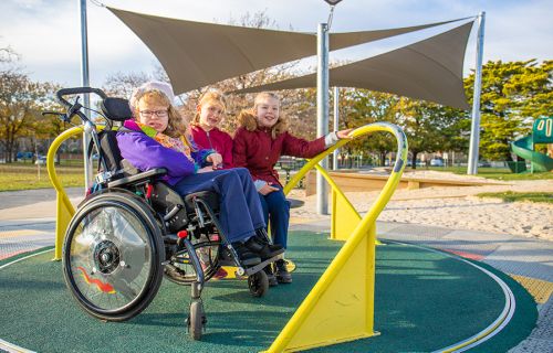 Girls playing in the inclusive playspace in Victoria park