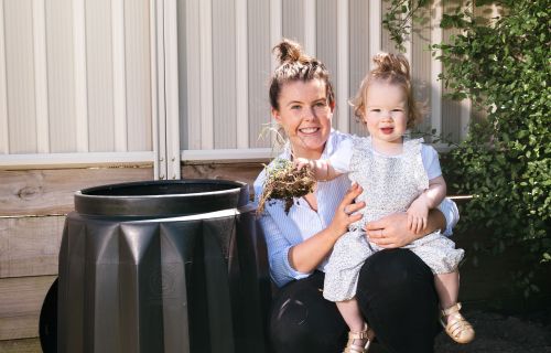 City of Ballarat Environmental Support Officer Emma Swift shows Marley Jones how to make compost