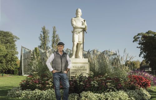 Ballarat Botanical Gardens Parks and Nursery Curator Peter Marquand with the statue of Sir William Wallace