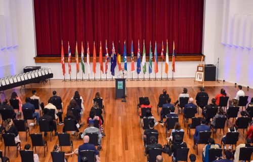 a citizenship ceremony in a large hall