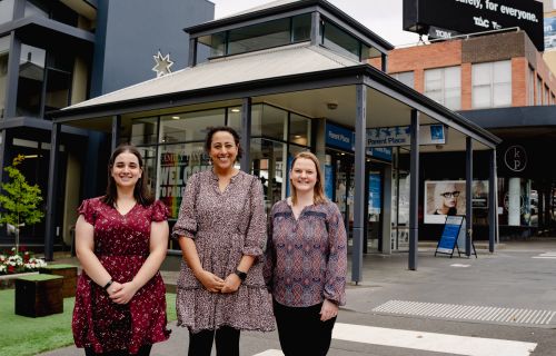 Three women standing out the front of parent place in central Ballarat