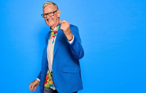 older man in blue jacket dancing