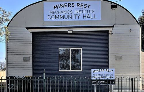 Photo of the front entrance of Miners Rest Mechanics Institute Hall with arched front