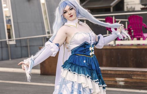 lady in cosplay with blue hair and corseted dress