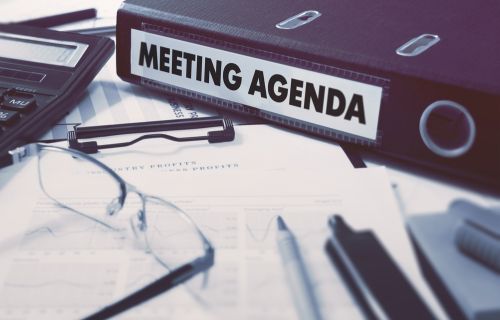 image of folder on table saying meeting agenda