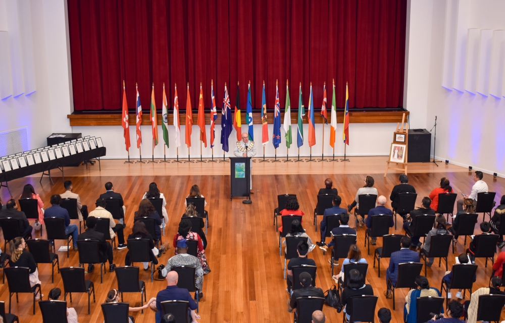 a citizenship ceremony in a large hall