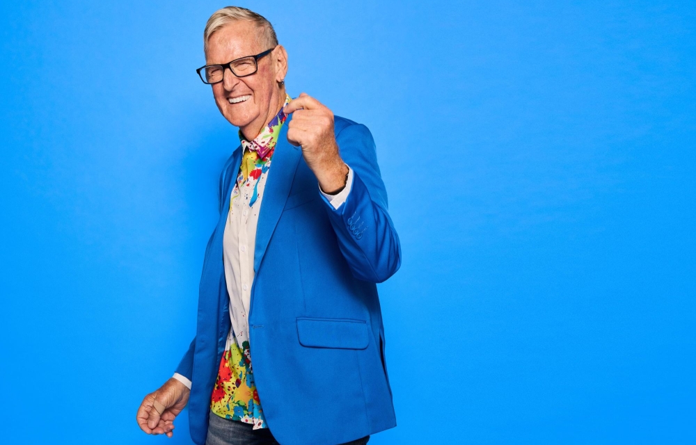 older man in blue jacket dancing