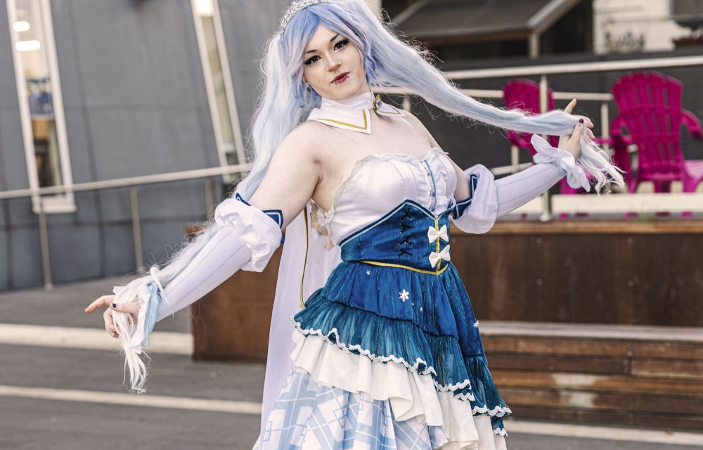lady in cosplay with blue hair and corseted dress